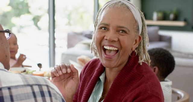 Happy Senior Woman Enjoying Family Meal at Home - Download Free Stock Images Pikwizard.com