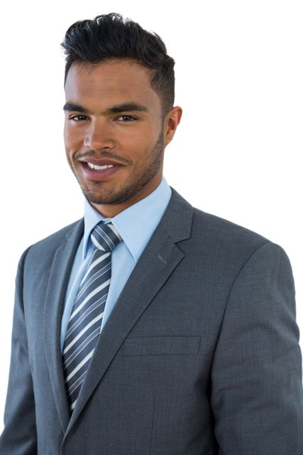 This image features a confident young businessman smiling while wearing a suit and tie. Ideal for use in corporate websites, business presentations, professional profiles, and marketing materials to convey professionalism, success, and leadership.
