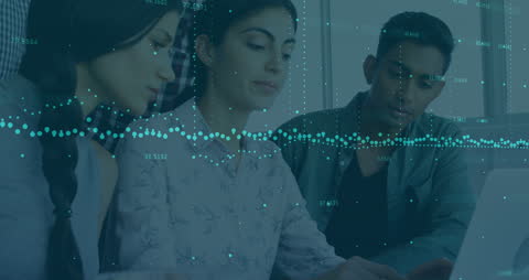 Team Analyzing Financial Data Visualizations in Office