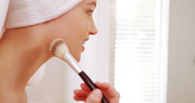 Smiling Woman Applying Makeup After Shower - Download Free Stock Images Pikwizard.com