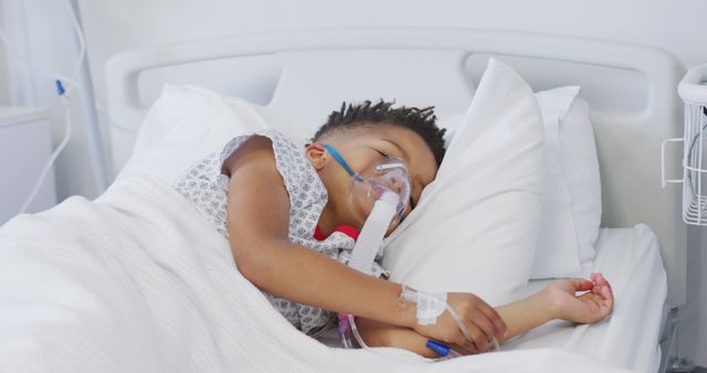 Child lying in a hospital bed with an oxygen mask, recovering from illness. Ideal for healthcare, medical, pediatric, hospital, and recovery related themes. Useful for illustrating concerns regarding children's health and hospital care.