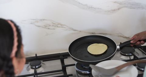 Home Cooking Pancakes on Modern Kitchen Stove - Download Free Stock Images Pikwizard.com