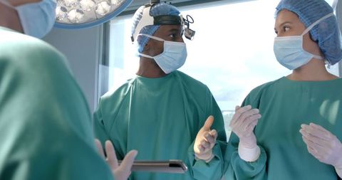 Healthcare Professionals Discussing in Operating Room