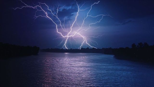 Dramatic Lightning Storm Above Tranquil Lake