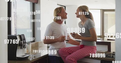 Couple sharing morning coffee in modern kitchen setting