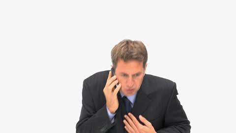 Anxious Businessman Arguing over Phone in Office Setting