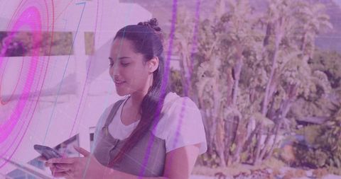 Woman Engaging with AR Technology on Modern Balcony Outdoors