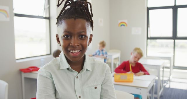 Confident Young Student Smiling in Classroom, Diverse Education Setting - Download Free Stock Images Pikwizard.com