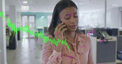 Businesswoman in office analyzing financial data on phone