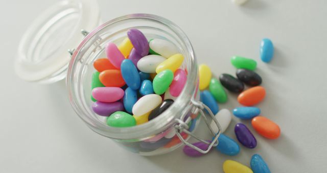 Colorful Jelly Beans in Glass Jar on Light Background - Download Free Stock Images Pikwizard.com