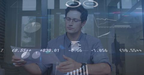 Businessman analyzing digital financial projections in office