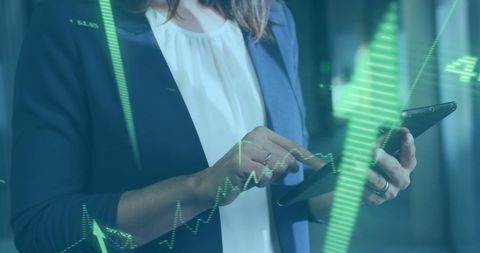 Businesswoman Analyzing Data with Tablet in Office Environment - Download Free Stock Images Pikwizard.com