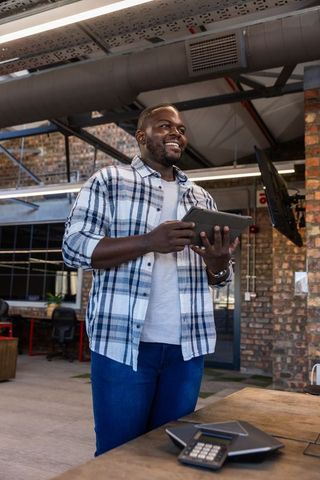 Professional communicating in modern industrial office environment