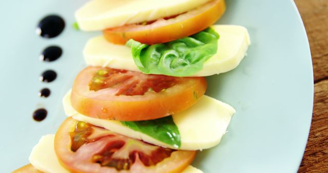 Fresh Caprese Salad with Tomatoes, Mozzarella, and Basil on Plate - Download Free Stock Images Pikwizard.com