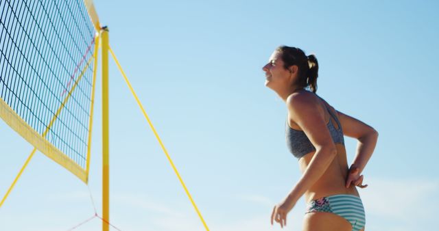 Female Beach Volleyball Player Smiling on Court - Download Free Stock Images Pikwizard.com