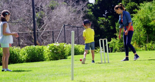 Mother Playing Cricket with Children in Park on Sunny Day - Download Free Stock Images Pikwizard.com