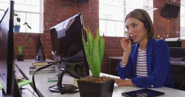 Woman in Blue Blazer Takes Business Call in Modern Office - Download Free Stock Images Pikwizard.com