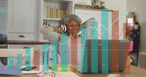 Senior woman analyzing financial data with laptop