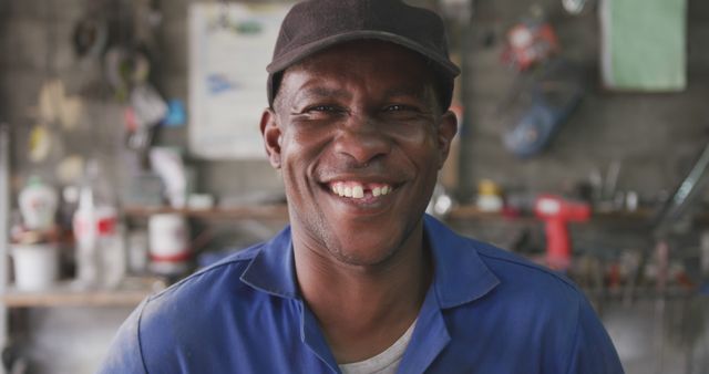 Smiling Mechanic in Workshop - Download Free Stock Images Pikwizard.com