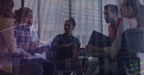 Business Team Analyzing Data Trends in Collaborative Meeting