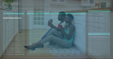 Young Adults Engaged with Digital Devicesamidst Data Terminal Overlay