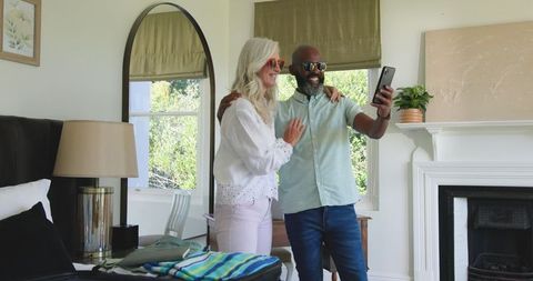 Happy Senior Couple Preparing for Wedding Trip Together