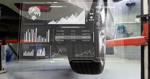 Automotive diagnostics hud displaying telemetry and tire data on car wheel in workshop
