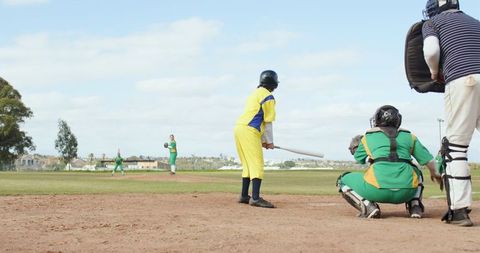 Community baseball game on sunny day capturing the action