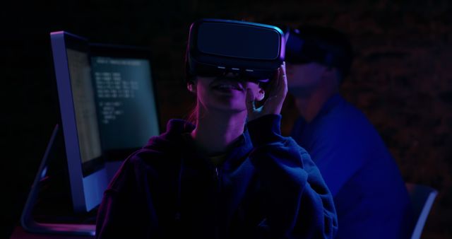 VR Enthusiasts Immersed in Virtual Reality Experience During Night - Download Free Stock Images Pikwizard.com