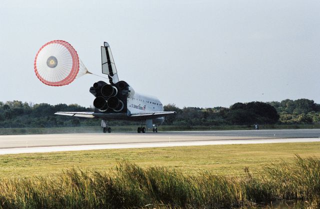 STS113-S-043 (7 December 2002) --- The drag chute on the Space Shuttle Endeavour deploys to slow down the spacecraft during landing on runway 33 at the KSC landing facility, completing the nearly 14-day STS-113 mission to the International Space Station (ISS). Astronaut James D. Wetherbee, mission commander, eased Endeavour to a textbook landing on runway 33 at the Florida spaceport at 2:37 p.m. (EST) on December 7, 2002. The landing completed a 5.74-million mile mission that saw successful delivery and installation of the Port One (P1) truss on the orbital outpost.