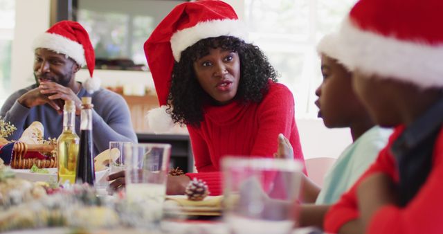 Family Enjoying Christmas Dinner Together with Santa Hats - Download Free Stock Images Pikwizard.com