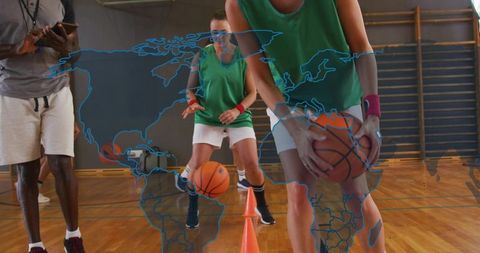 Basketball dribbling drill with coach guiding players through cone agility training
