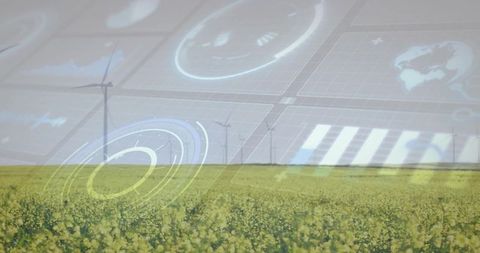 Wind Turbines Rising Over Canola Field with Digital Renewable Energy HUD Concept