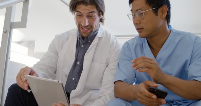 Medical Professionals Discussing Patient Data on Tablet - Download Free Stock Images Pikwizard.com