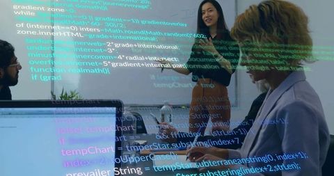 Mid adult woman leading coding presentation in modern office