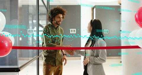 Entrepreneurs shaking hands at modern office launch with red ribbon and data overlay