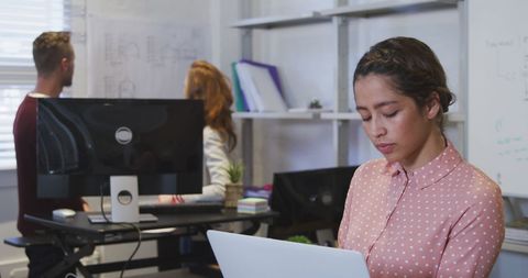 Young Biracial Woman Reviewing Documents in Modern Office - Download Free Stock Images Pikwizard.com