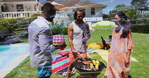 Friends grilling and relaxing by poolside lawn during summer backyard barbecue