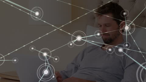 Man Engaging with Digital Network on Laptop