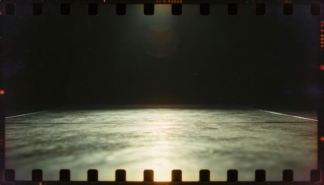 Cinematic film-strip stage floor reflecting lens flare, vintage grain, sprocket frame