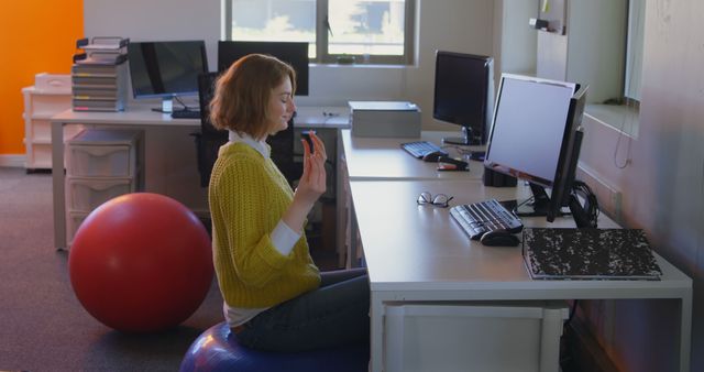 Woman Practicing Desk Yoga in Modern Office Space - Download Free Stock Images Pikwizard.com