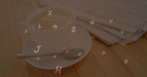 Coffee Cup with Alphabet Overlay Against Newspapers - Download Free Stock Images Pikwizard.com