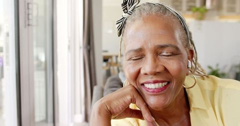 Smiling African American Senior Woman in Yellow Shirt