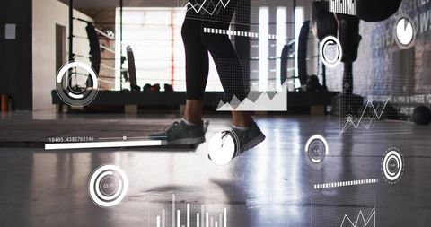 Athlete jumping on step platform with performance hud overlay in industrial gym studio