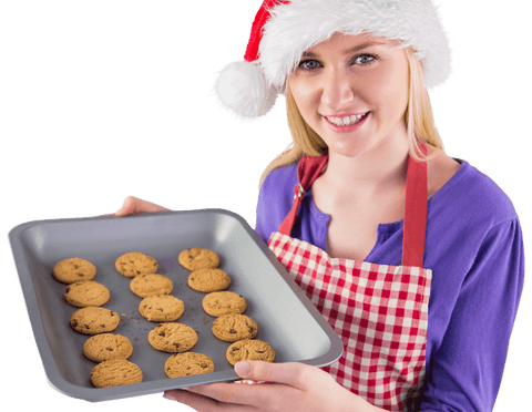 woman in santa hat holding cookie tray on transparent background - Download Free Stock Videos Pikwizard.com