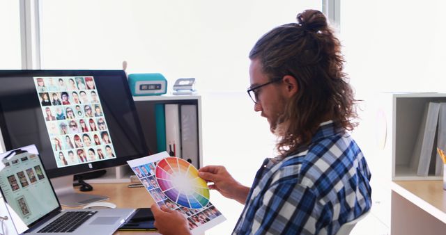 Graphic Designer Working On Computer and Color Palette In Modern Office - Download Free Stock Images Pikwizard.com