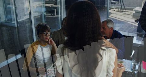 Businesswoman Presenting Ideas at Modern Office Conference Table