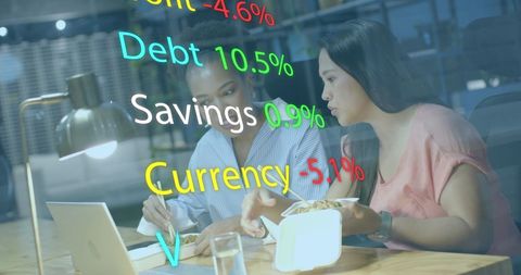 Diverse Businesswomen Analyzing Financial Data in Office Environment