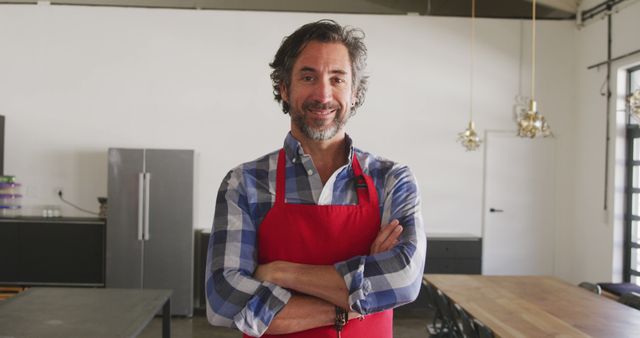 Confident Male Chef in Apron Standing in Modern Kitchen - Download Free Stock Images Pikwizard.com