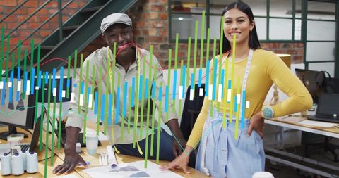 Fashion Designers Analyzing Data with Digital Overlay Graphs